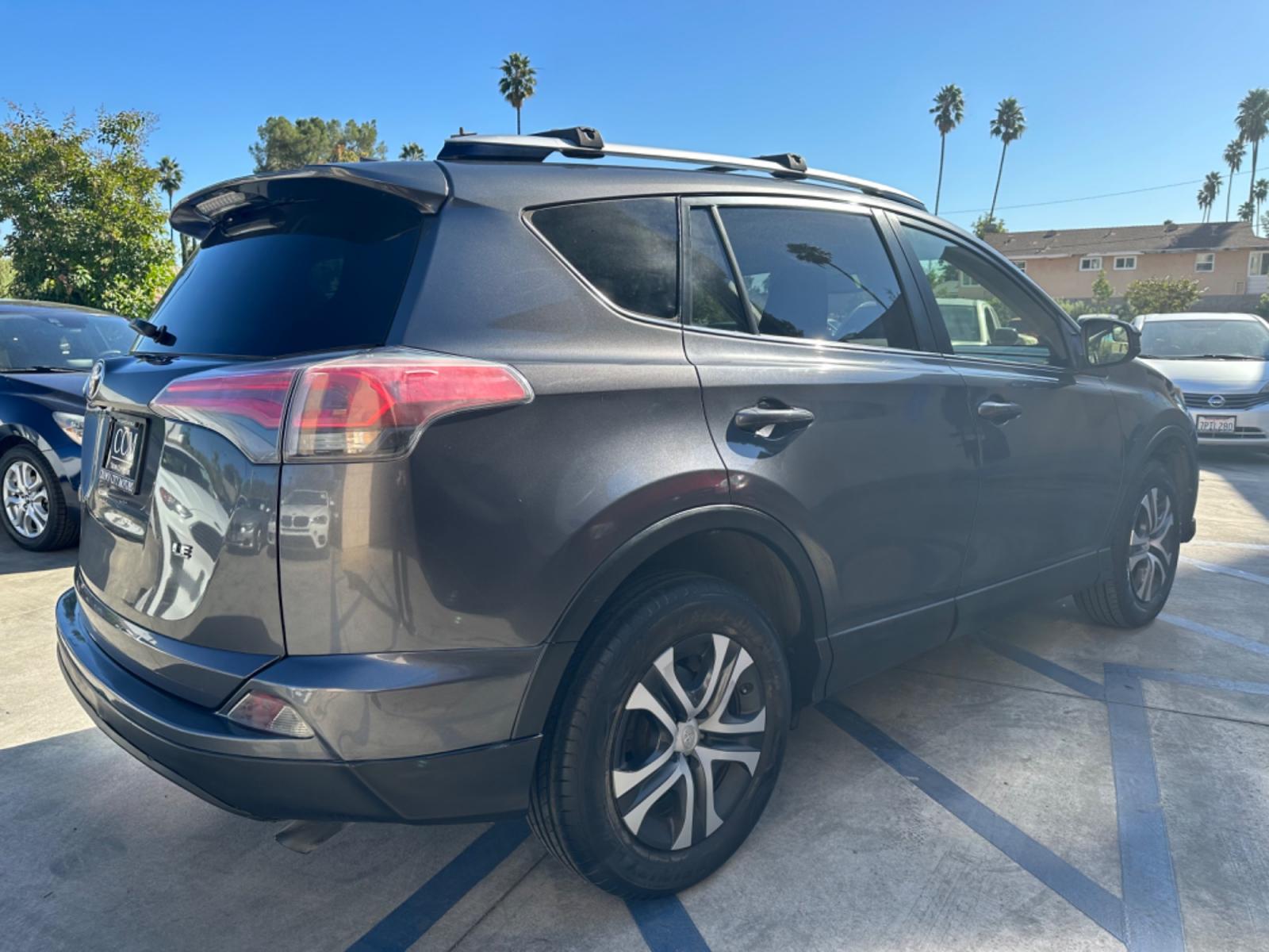 2016 Gray /Black Toyota RAV4 (JTMZFREVXGJ) , AUTOMATIC transmission, located at 30 S. Berkeley Avenue, Pasadena, CA, 91107, (626) 248-7567, 34.145447, -118.109398 - Crown City Motors is a used “Buy Here Pay Here” car dealer in Pasadena CA. “Buy Here Pay Here” financing, means that when you purchase your vehicle from our dealership, that you make the payments to the dealership as well. We do not need the banks approval to get you approved for a used auto - Photo #4